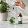 Fifteen drops of Verdia blooming in a glass of water